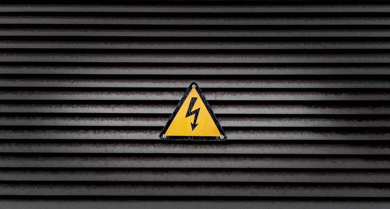 yellow danger sign black striped wall