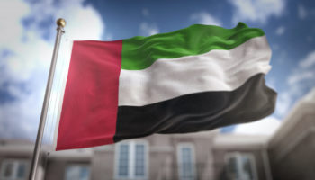 united arab emirates flag 3d rendering blue sky building background