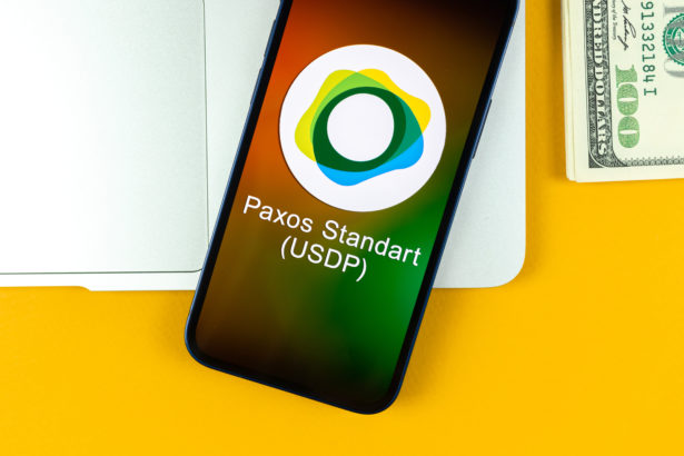paxos standart usdp coin symbol trade with cryptocurrency digital virtual money banking with mobile phone concept business workspace table with laptop top view photo